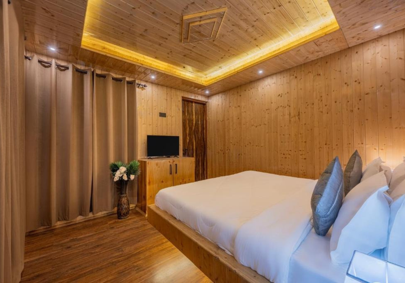 Studio room interior with warm wooden decor and cosy lighting
